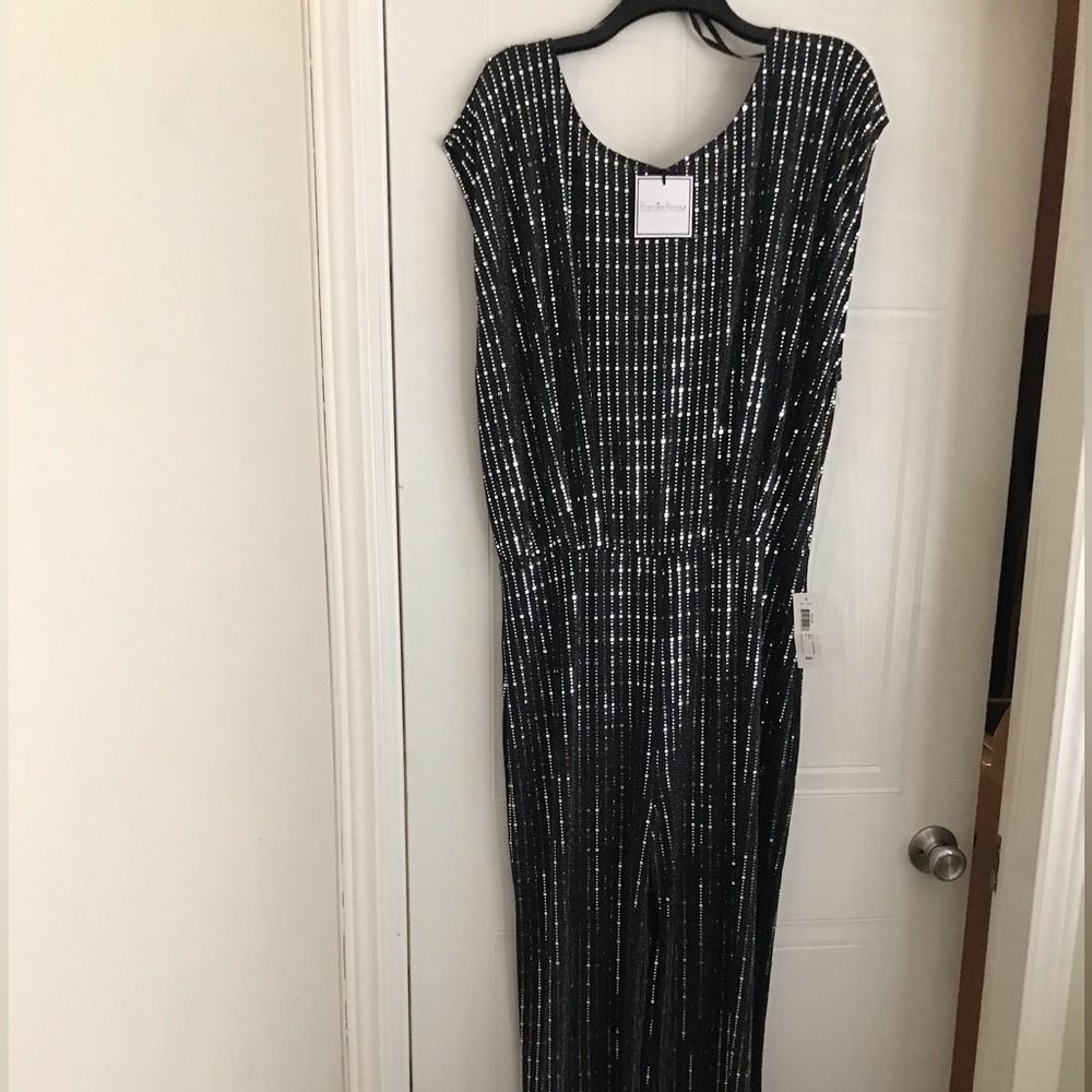 Black and Silver jumpsuit size 16. Jumpsuit is very tall girl friendly 🙂